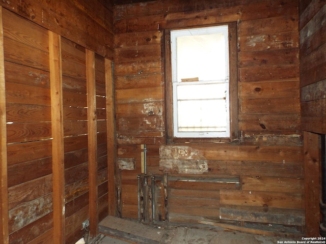 interior space featuring wooden walls