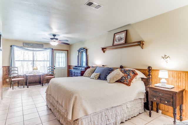 tiled bedroom with ceiling fan