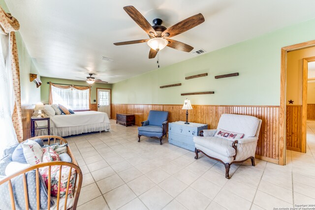 tiled bedroom with ceiling fan