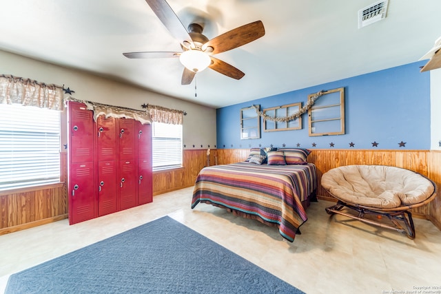 tiled bedroom with ceiling fan