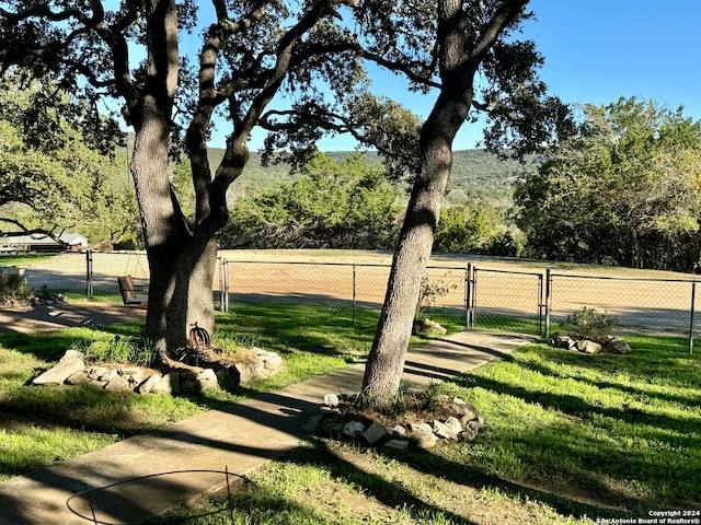 surrounding community featuring a yard