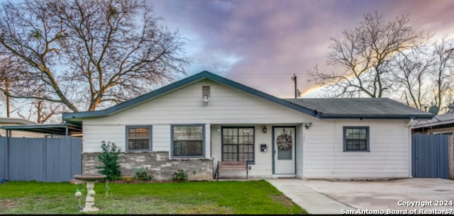 ranch-style house with a yard