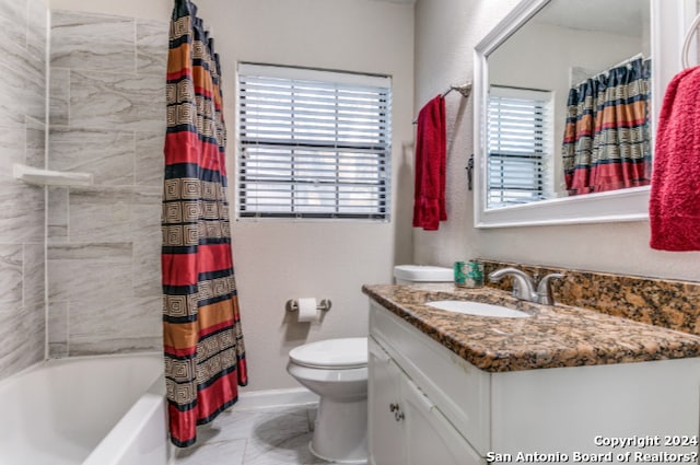 full bathroom featuring vanity, toilet, and shower / tub combo with curtain