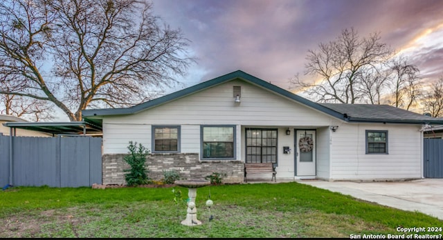 view of front of house with a yard