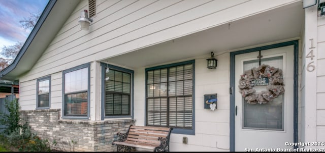 property entrance featuring covered porch