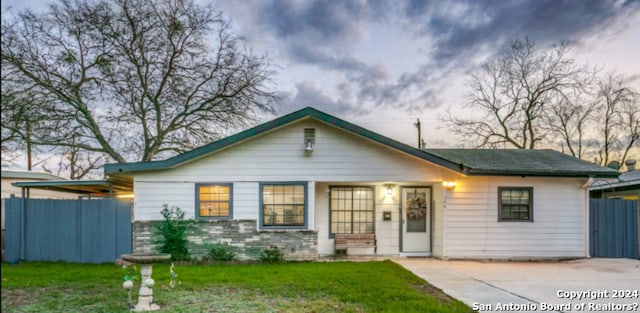 ranch-style house featuring a yard