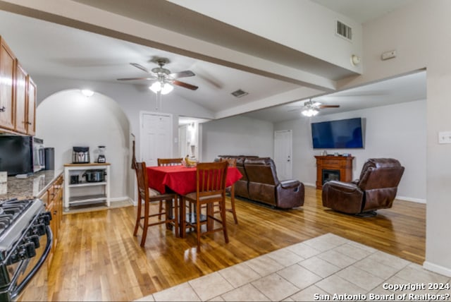 dining space with ceiling fan and light hardwood / wood-style flooring