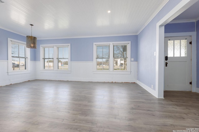 interior space with hardwood / wood-style flooring and ornamental molding