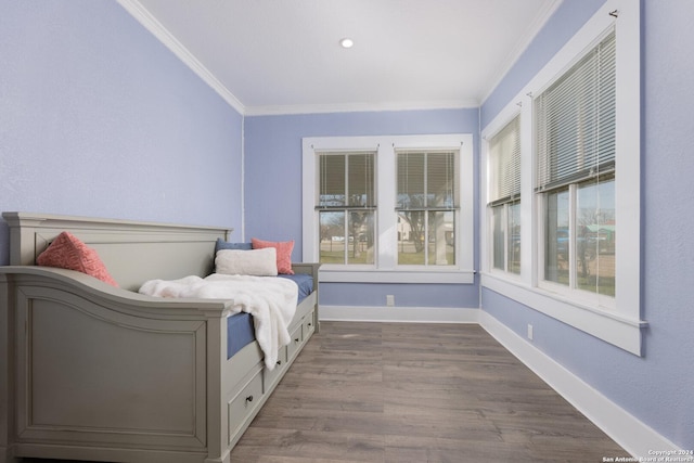 bedroom featuring dark hardwood / wood-style flooring and ornamental molding