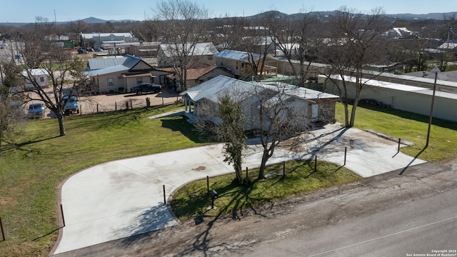 birds eye view of property with a mountain view