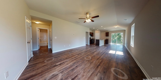 unfurnished living room featuring ceiling fan, vaulted ceiling, and wood-type flooring