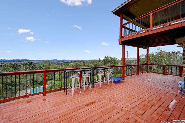 wooden deck with a swimming pool