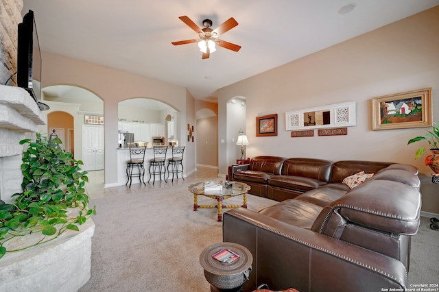 living room featuring ceiling fan and light carpet