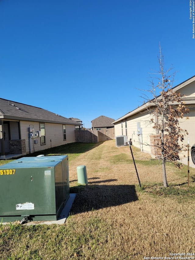 view of yard with central AC