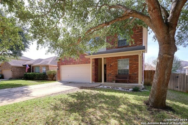 view of front facade featuring a garage and a front yard