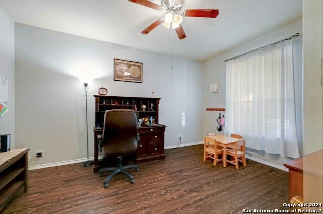 office space with ceiling fan and dark hardwood / wood-style flooring