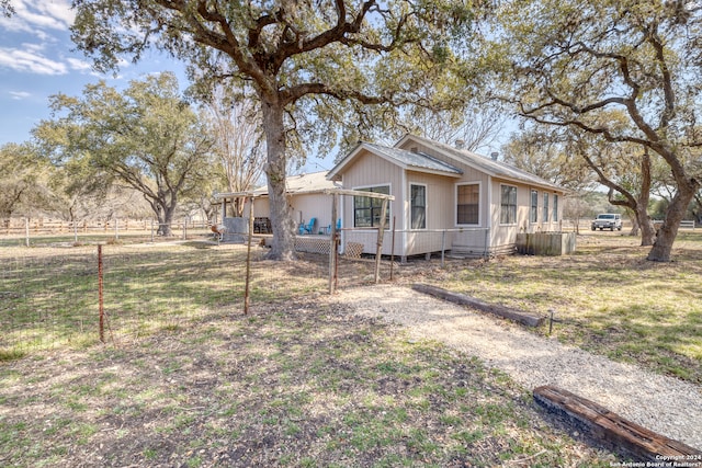 view of front of house with a front lawn and a wooden deck