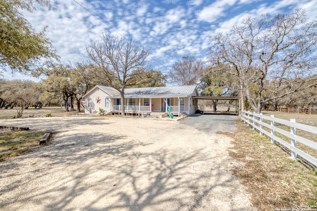 view of front of house featuring a carport and a porch