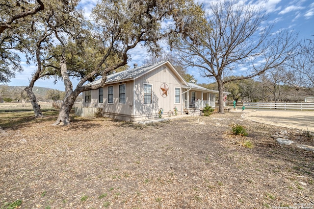 view of property exterior featuring a porch