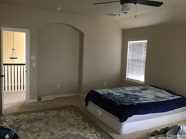 carpeted bedroom featuring ceiling fan