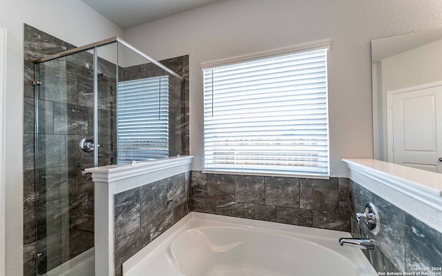 bathroom with independent shower and bath