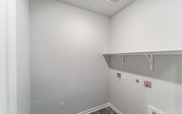 clothes washing area featuring hookup for a washing machine, gas dryer hookup, and hookup for an electric dryer