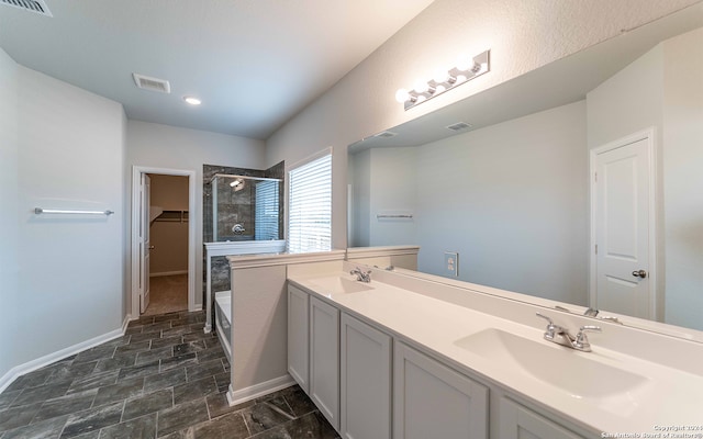 bathroom featuring vanity, independent shower and bath, and tile patterned floors