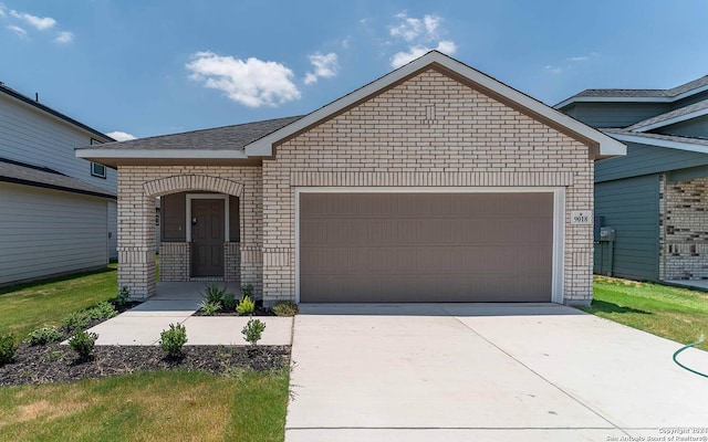 ranch-style home with concrete driveway, brick siding, and a garage