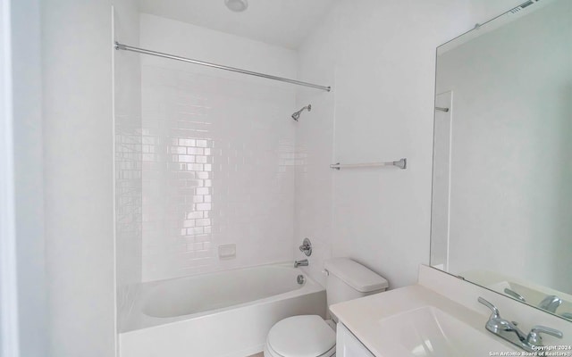 bathroom with toilet, shower / bath combination, and vanity