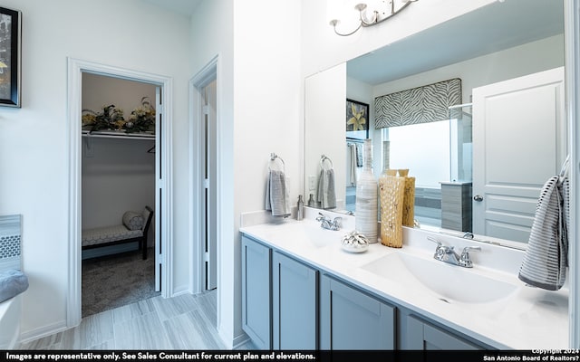 bathroom with double sink vanity and tile flooring