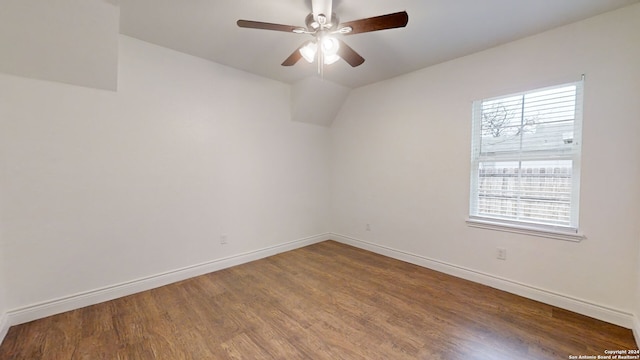 spare room featuring dark hardwood / wood-style floors and ceiling fan