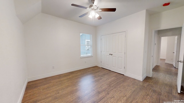 unfurnished bedroom with dark hardwood / wood-style flooring, ceiling fan, and a closet