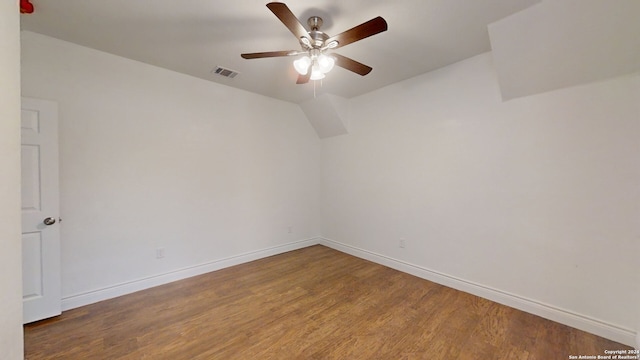 empty room featuring dark hardwood / wood-style flooring and ceiling fan