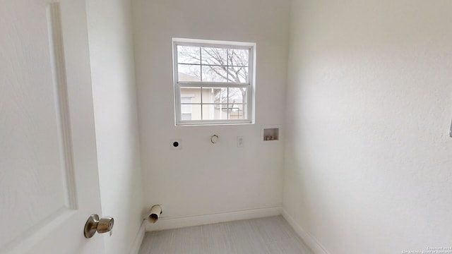 laundry room featuring light tile flooring, electric dryer hookup, and hookup for a washing machine