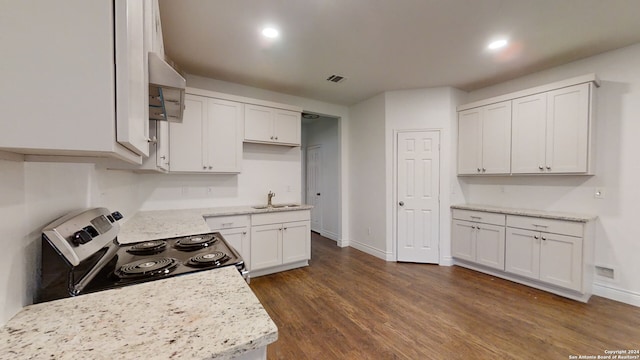 kitchen featuring stove, dark wood-type flooring, white cabinetry, and light stone counters