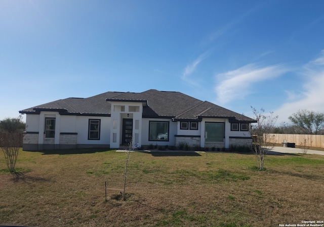 prairie-style home featuring a front yard