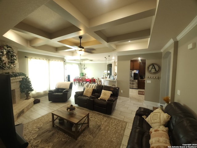 living room featuring coffered ceiling, beam ceiling, light tile flooring, ceiling fan, and crown molding