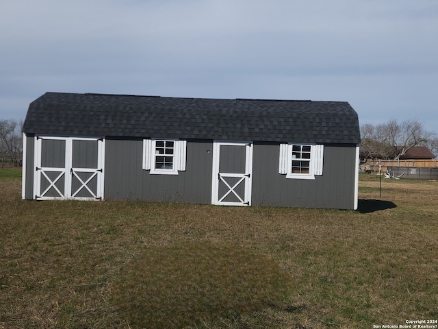 view of shed / structure featuring a yard