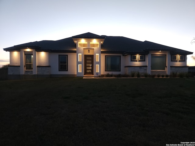 prairie-style house with a yard