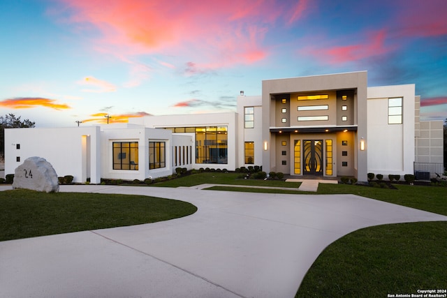 view of front of home with a lawn