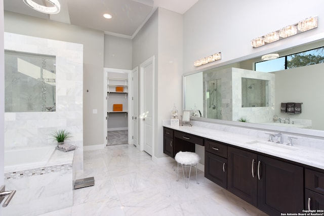 bathroom with tile flooring, vanity, and independent shower and bath