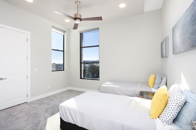 carpeted bedroom with ceiling fan