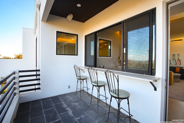 view of balcony at dusk