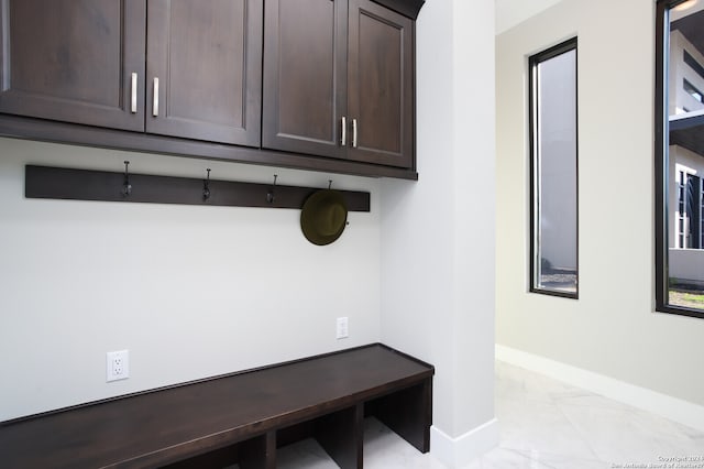 mudroom with light tile floors and a healthy amount of sunlight