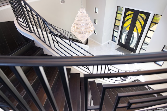 staircase with french doors