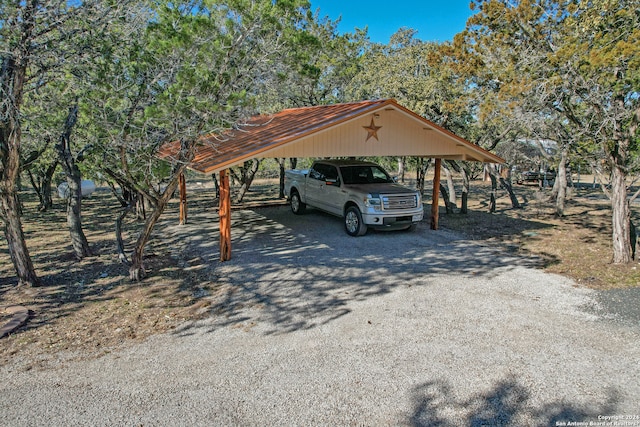 view of vehicle parking featuring a carport