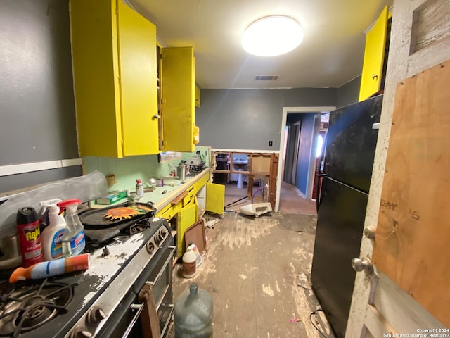 kitchen featuring black fridge