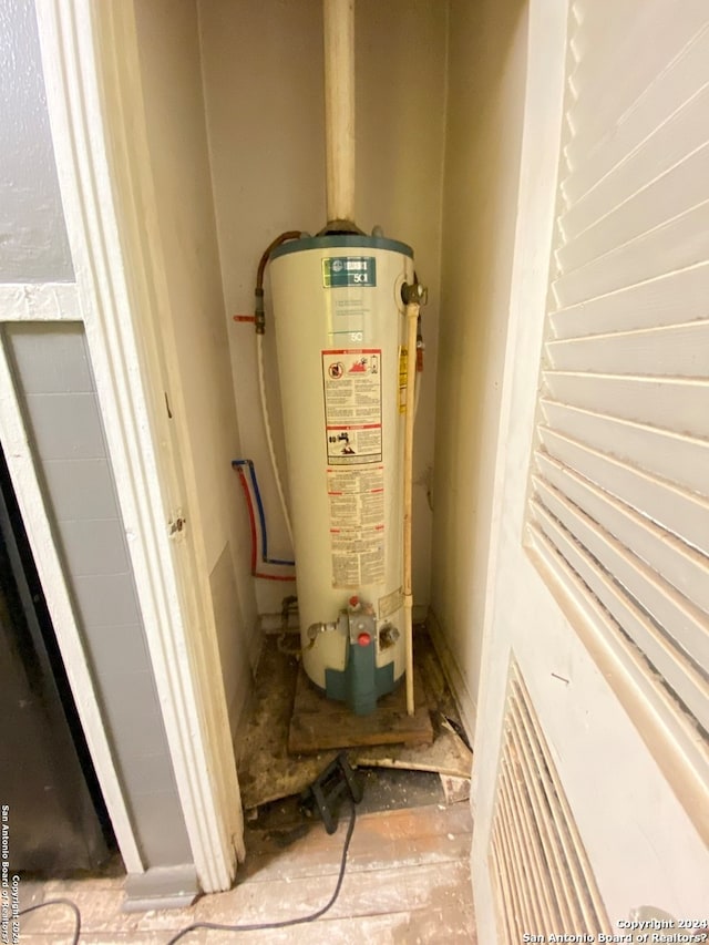 utility room with water heater