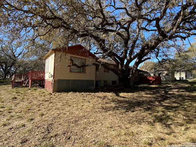 view of side of home featuring a yard