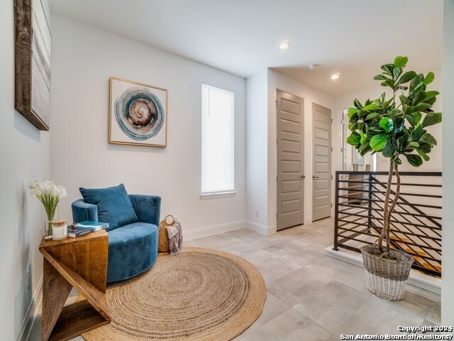 living area with light tile floors